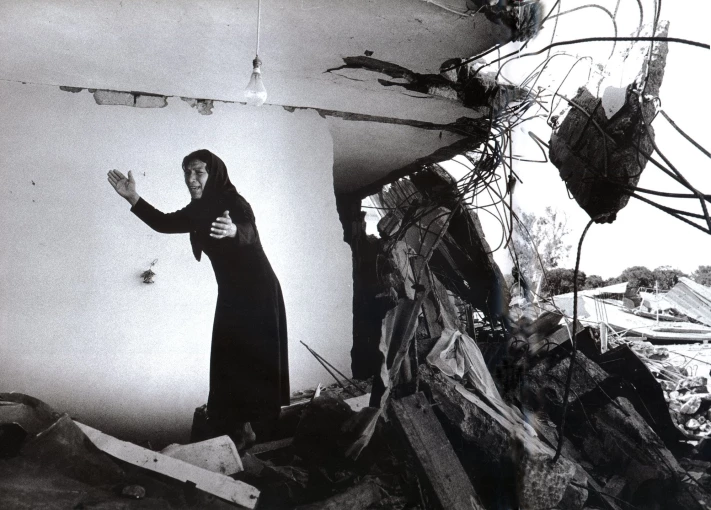 Don-McCullin-A-Palestinian-Woman-Returning-to-the-Ruins-of-her-House-Sabra-Beirut-1982-Hamiltons