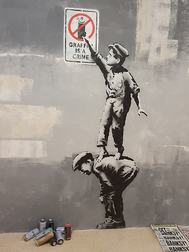 Banksy's-graffiti.-Photo-by-GualdimG